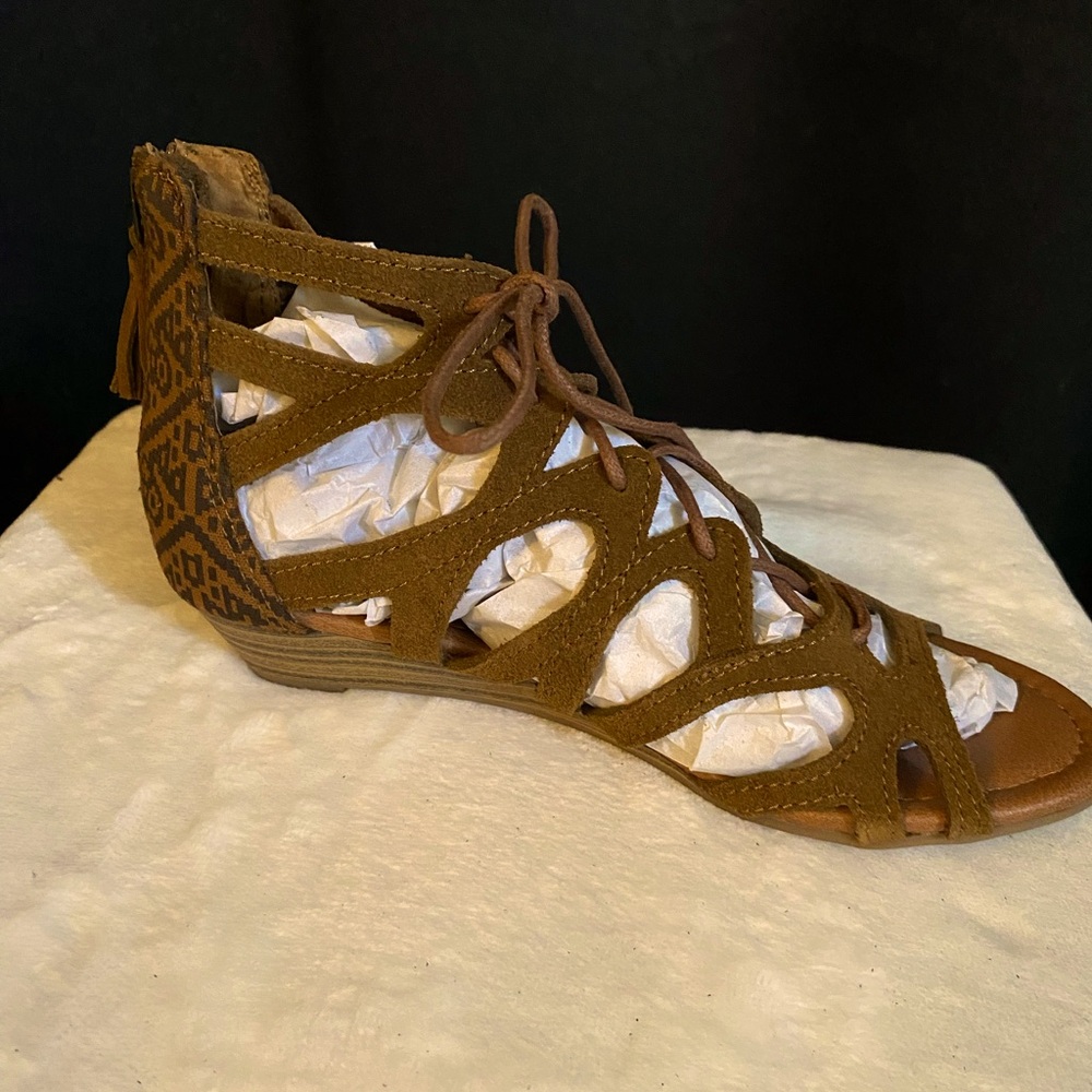 Minnetonka sandals. Brand new. Never worn.